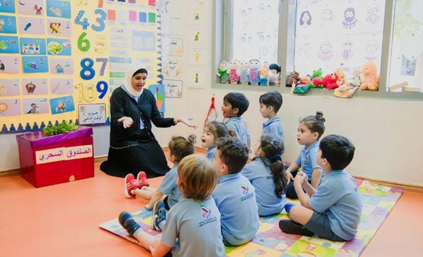 Educator leading group storytelling and interactive language session with preschool children at Bright Bingo